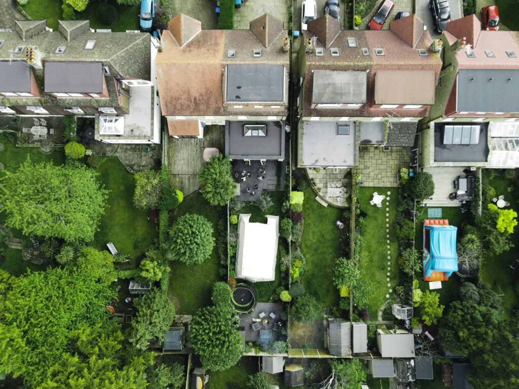 Aerial view of a row of terraced houses and gardens
